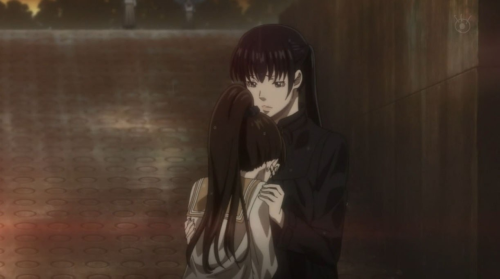 Shimotsuki crying in Kunizuka's arms in her school uniform in Season 1.