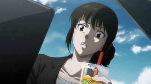 Shimotsuki looking at her computer with a shocked expression and a drink in hand.